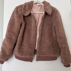 Skies are blue brown jacket